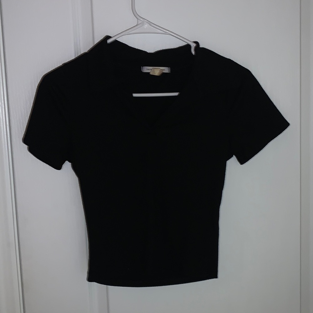 Tight, cropped, black collared top